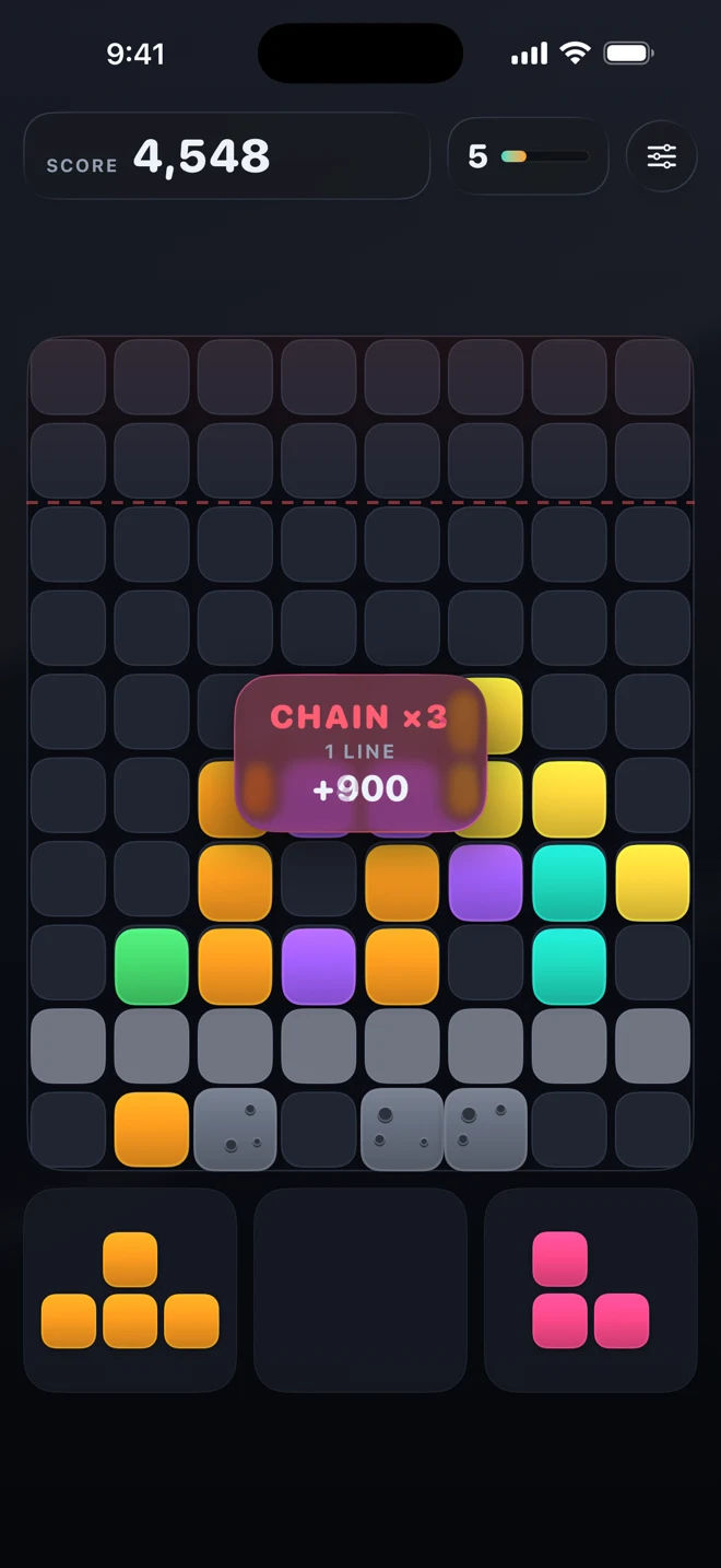 Overburden mid-run: a CHAIN x3 banner reading 1 LINE, +900 over a board of orange, purple and teal blocks, with grey rubble along the bottom rows.